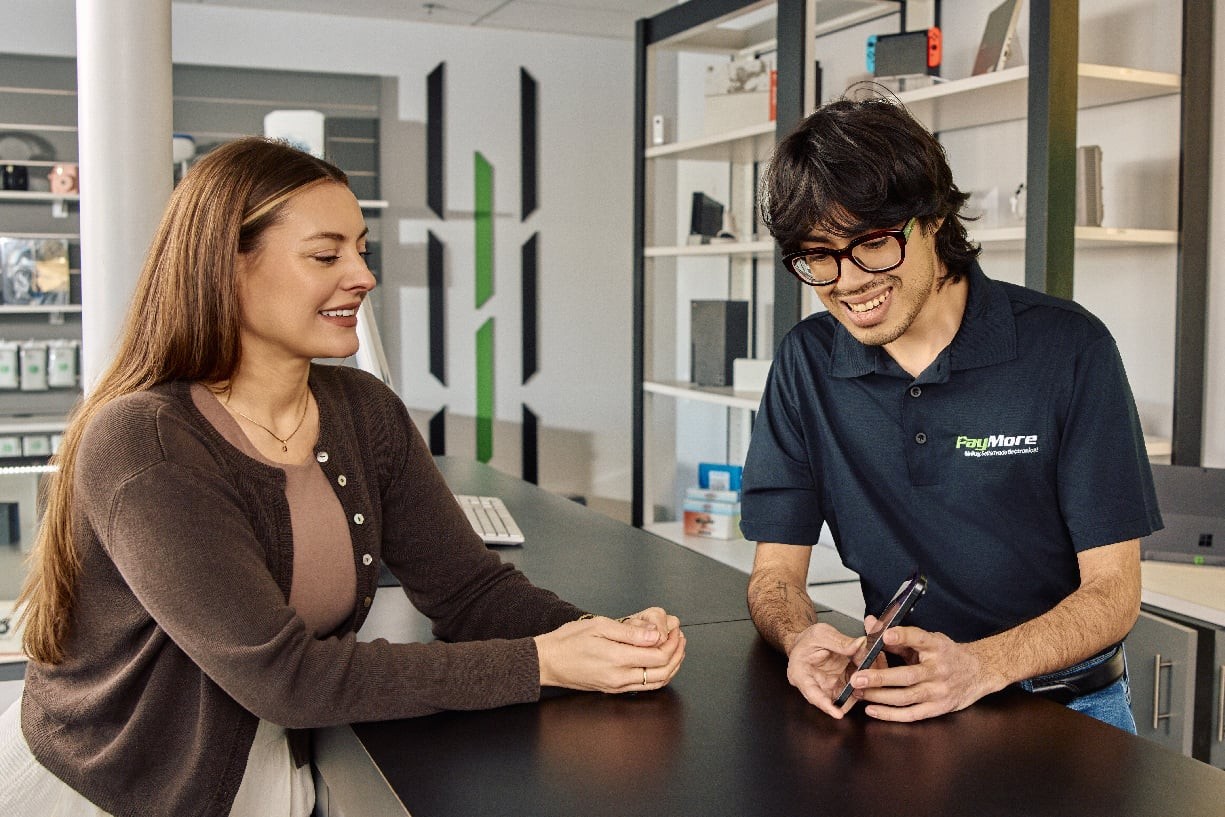 Woman selling a phone at PayMore